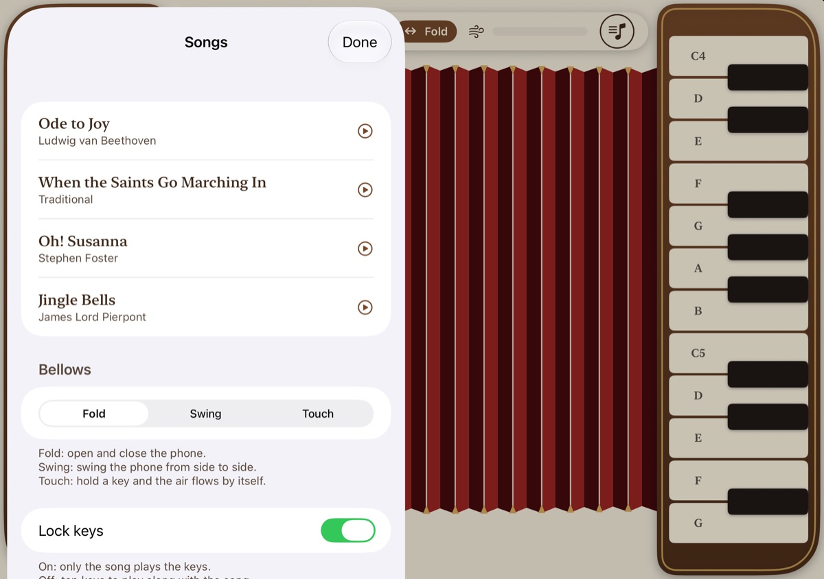 The Songs sheet on iPhone Duo: Ode to Joy, When the Saints Go Marching In, Oh! Susanna and Jingle Bells, then a Bellows picker with Fold, Swing and Touch, and a Lock keys switch.